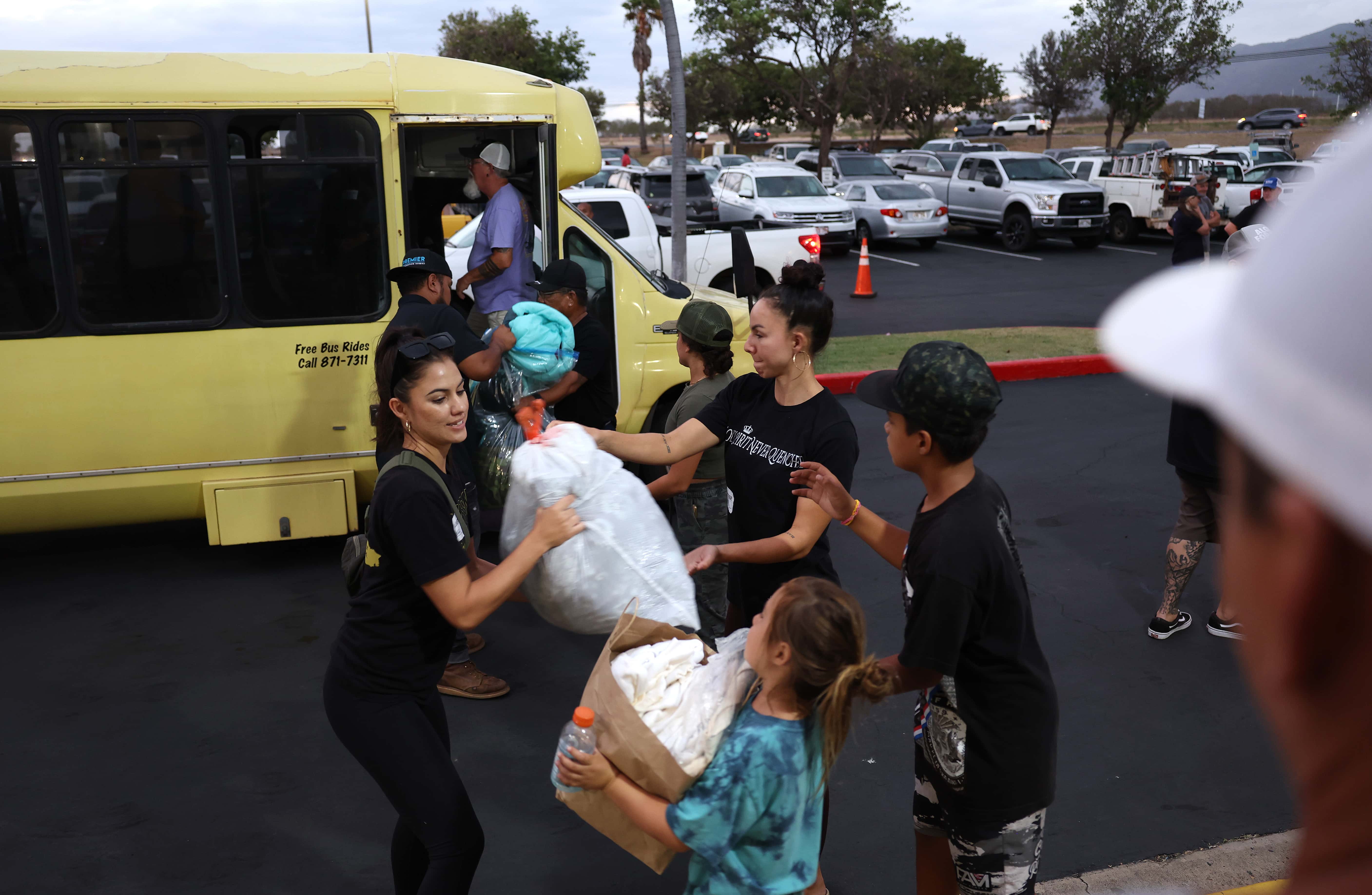 Volunteers with King's Cathedral Maui unload donations of blankets and supplies on August 10, 2023, in Kahului, Hawaii. Dozens of people were killed and thousands displaced after a wind-driven wildfire devastated the town of Lahaina on Tuesday. (Photo by Justin Sullivan/Getty Images)
