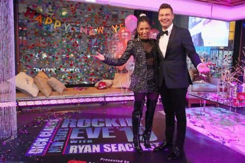 Liza Koshy and Ryan Seacrest pose on stage during Dick Clark's New Year's Rockin' Eve With Ryan Seacrest 2019 on December 31, 2018 in New York City.