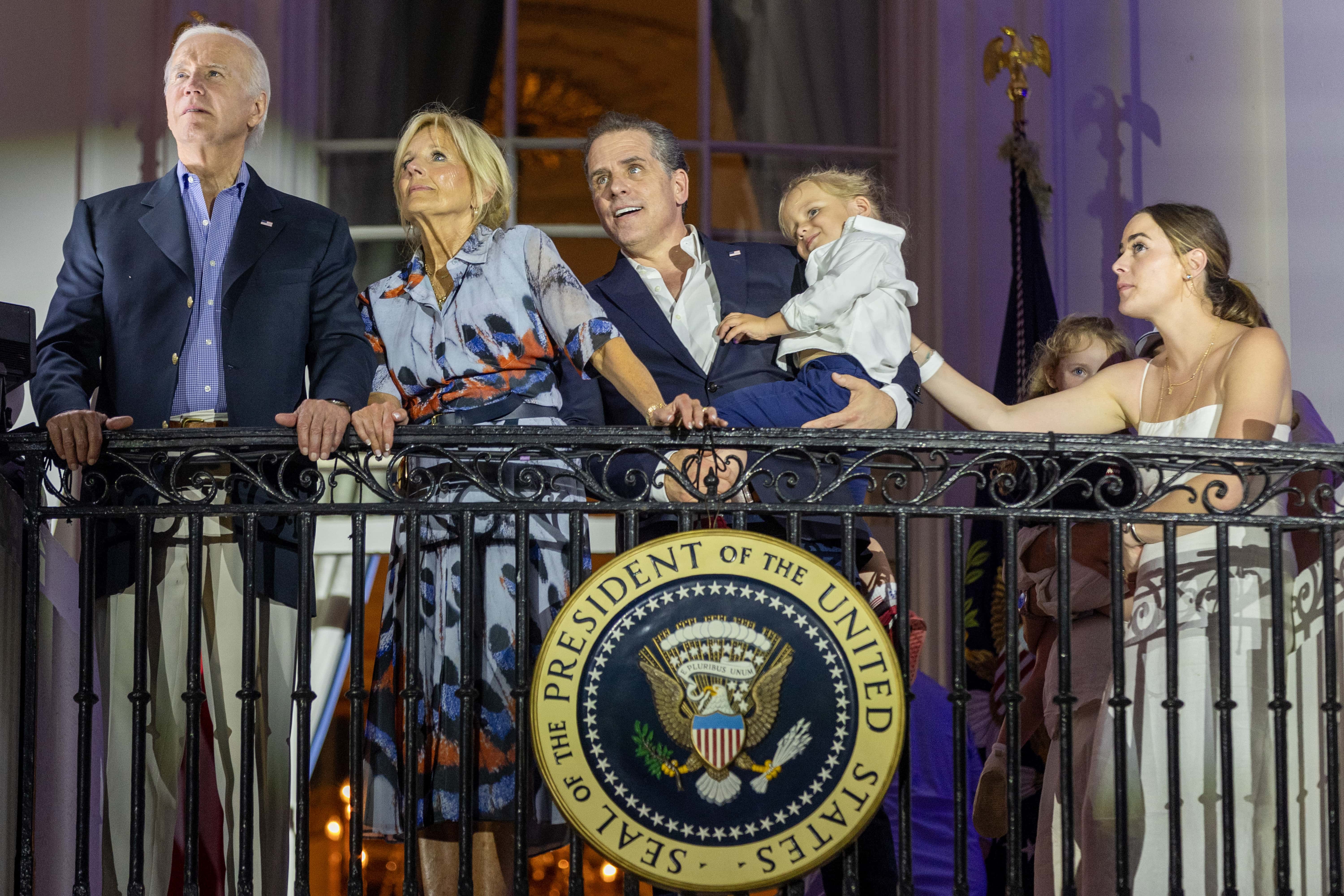 WASHINGTON, DC - JULY 04: (L-R) U.S. President Joe Biden, first lady Jill Biden, Hunter Biden holding Beau Biden and Naomi Biden watch fireworks on the South Lawn of the White House on July 04, 2023 in Washington, DC. The Bidens hosted a Fourth of July BBQ and concert with military families and other guests on the South Lawn of the White House. (Photo by Tasos Katopodis/Getty Images)