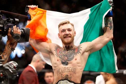 Conor McGregor celebrates after a first-round knockout victory over Jose Aldo in their featherweight title fight during UFC 194 on December 12, 2015 in Las Vegas, Nevada.