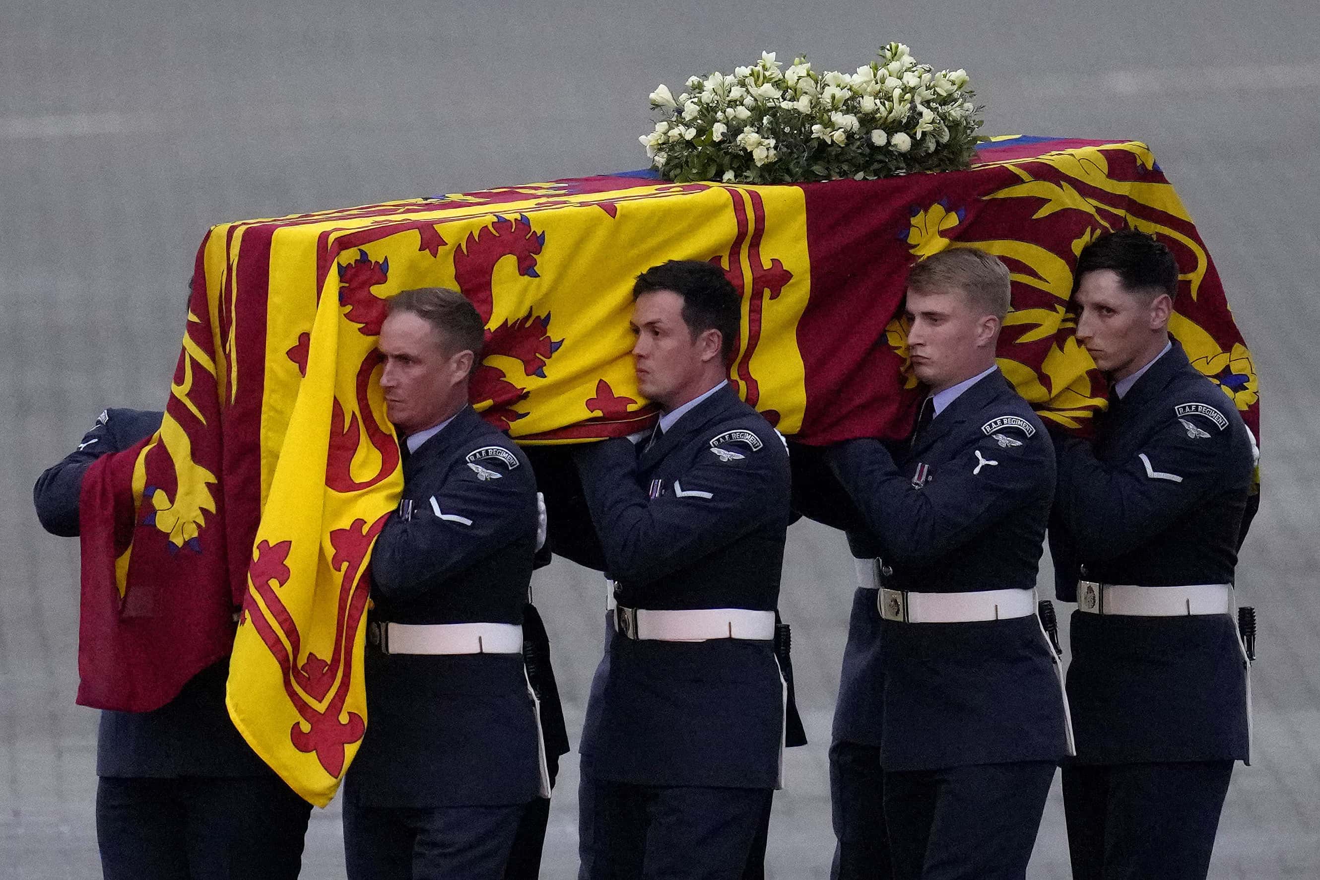 The coffin of Queen Elizabeth II is carried off a plane by the Queen's Colour Squadron at RAF Northolt, west London, from where it will be taken to Buckingham Palace, London, to lie at rest overnight in the Bow Room on September 13, 2022 in London, England. The coffin carrying Her Majesty Queen Elizabeth II leaves St Giles Church travelling to Edinburgh Airport where it will be flown to London and transferred to Buckingham Palace by road. Queen Elizabeth II died at Balmoral Castle in Scotland on September 8, 2022, and is succeeded by her eldest son, King Charles III. (Photo by Kirsty Wigglesworth - WPA Pool/Getty Images)