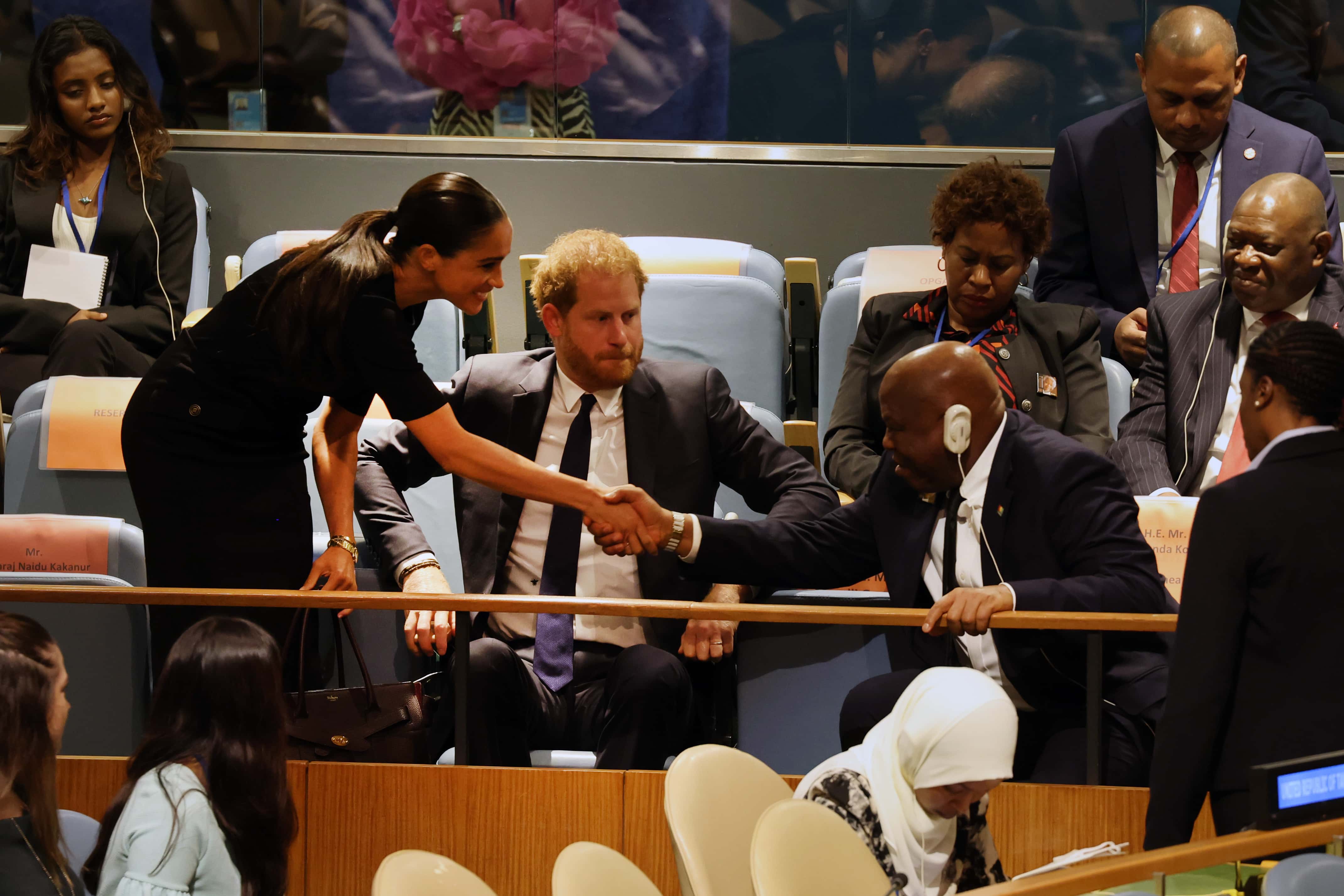 Prince Harry and his wife Meghan Markle greet Guinea’s foreign minister, Morissanda Kouaté as they depart after the Prince addressed the United Nations (UN) general assembly during the UN's annual celebration of Nelson Mandela International Day on July 18, 2022 in New York City. The Prince, the keynote speaker, will speak about the legacy and inspiration of the South African anti-apartheid leader who spent 27 years in a remote South African prison before becoming the president and first black leader of the country. The 37-year-old Duke of Sussex attended the event with his wife Meghan Markle. (Photo by Spencer Platt/Getty Images)