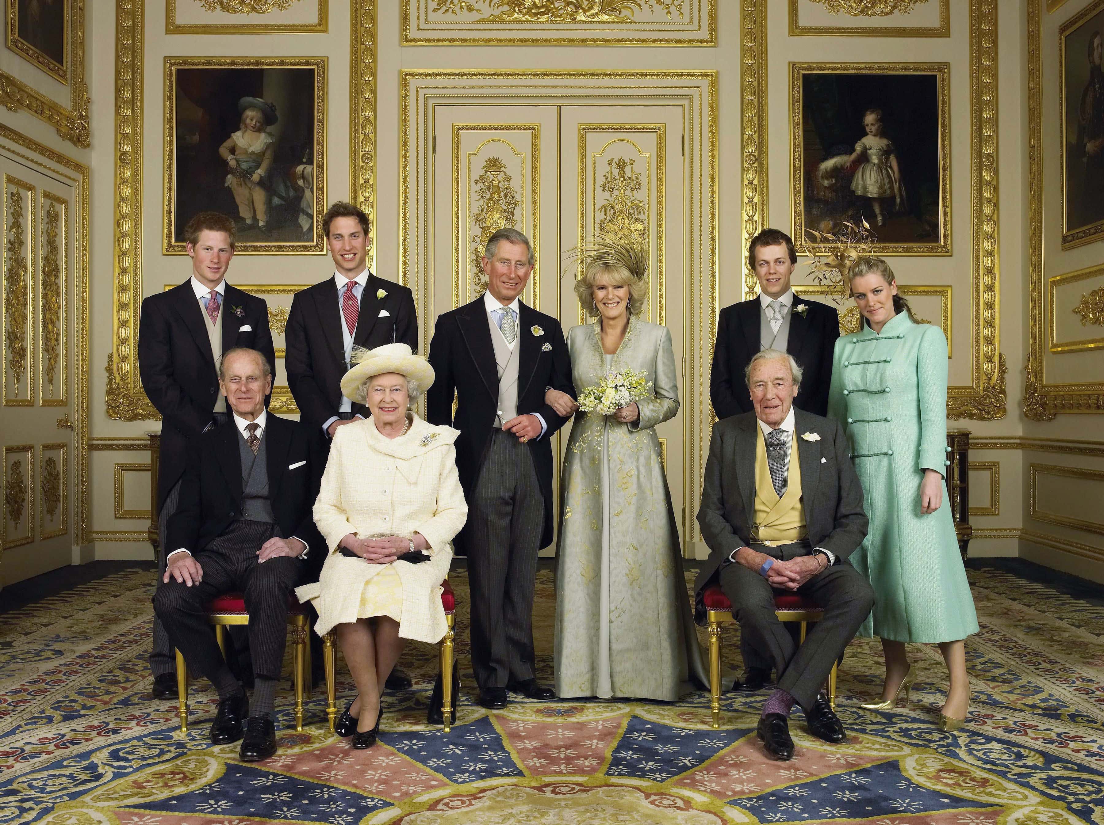 Clarence House official handout photo of the Prince of Wales and his new bride Camilla, Duchess of Cornwall, with their families (L-R back row) Prince Harry, Prince William, Tom and Laura Parker Bowles (L-R front row) Duke of Edinburgh, Britain's Queen Elizabeth II and Camilla's father Major Bruce Shand, in the White Drawing Room at Windsor Castle after their wedding ceremony, April 9, 2005 in Windsor, England. (Photo by Hugo Burnand/Pool/Getty Images)