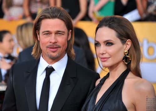 Actors Brad Pitt (L) and Angelina Jolie arrive at the 18th Annual Screen Actors Guild Awards at The Shrine Auditorium on January 29, 2012 in Los Angeles, California.
