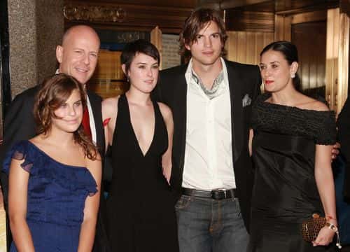 Actors Ashton Kutcher, Demi Moore and Bruce Willis pose with their children Rumer and Tallulah at the premiere of 
