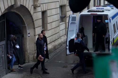 Andrew Tate (L) and Tristan Tate leave the Bucharest Court of Appeal after the hearing on their appeal to the decision of arrest for 30 days, on January 10, 2023 in Bucharest, Romania. British-US former professional kickboxer and controversial influencer Andrew Tate and brother Tristan Tate attend the hearing on their appeal against pre-trial detention for alleged human trafficking, rape and forming a criminal organisation.