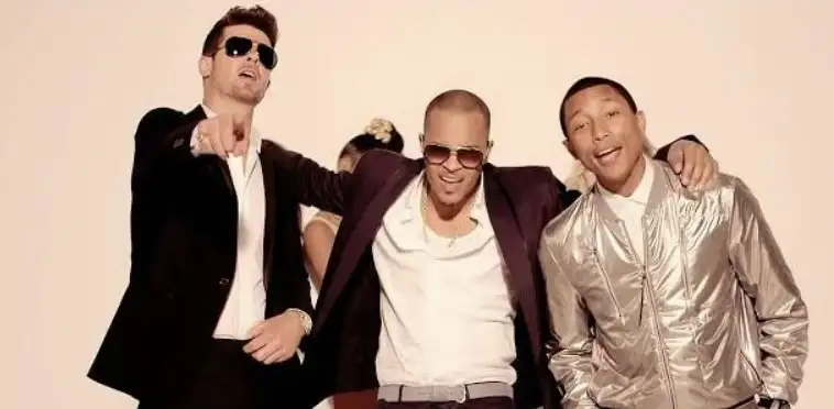Pharrell Williams, Robin Thicke, and T.I. in Robin Thicke feat. T.I. & Pharrell: Blurred Lines (2013) (IMDb)