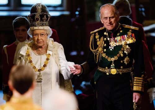 Queen Elizabeth II (L) and Prince Philip, Duke of Edinburgh proceed through the Royal Gallery in the Palace of Westminster during the State Opening of Parliament on May 9, 2012 in London, England. Queen Elizabeth II unveiled the coalition government's legislative programme in a speech delivered to Members of Parliament and Peers in The House of Lords. New legislation is expected to be introduced on banking reform, House of Lords reform, changes to public sector pensions and plans for increased internet monitoring.