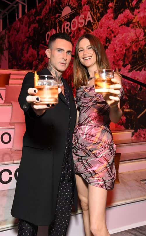 Co-founders, Adam Levine and Behati Prinsloo, host CALIROSA Tequila’s launch party at Ysabel in Los Angeles on November 18, 2021 in West Hollywood, California. CALIROSA is poised to redefine the spirits category with its unparalleled craftsmanship, uniquely smooth taste, and the blending of two time-honored beverage making processes - Jalisco's tequila craftsmanship and California winemaking - resulting in an award-winning line of red-wine barrel aged tequilas.
