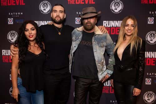 Hila Aronian, Weston Cage, Nicolas Cage, and guest attend the premiere of Quiver Distribution's 'Running with the Devil' at Writers Guild Theater on September 16, 2019 in Beverly Hills, California.