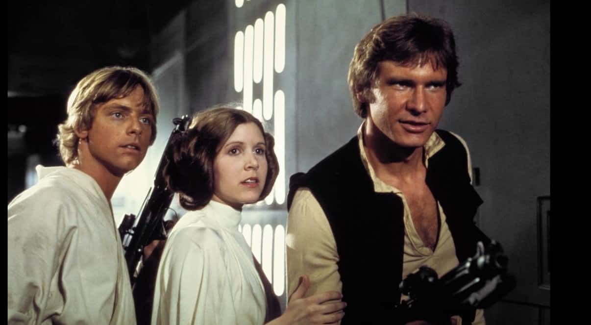 In her memoir, the ‘Screams 3’ star recalled how their romance started on a fine evening when Ford had saved her from crew members with bad intentions at George Lucas’ 32nd birthday party. (Screenshot/IMDb)