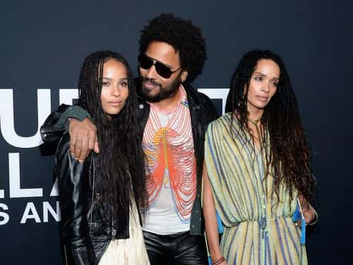 Musician Lenny Kravitz (center) and actresses Zoe Kravitz (L) and Lisa Bonet R) attend the Saint Laurent show at The Hollywood Palladium on February 10, 2016 in Los Angeles, California.