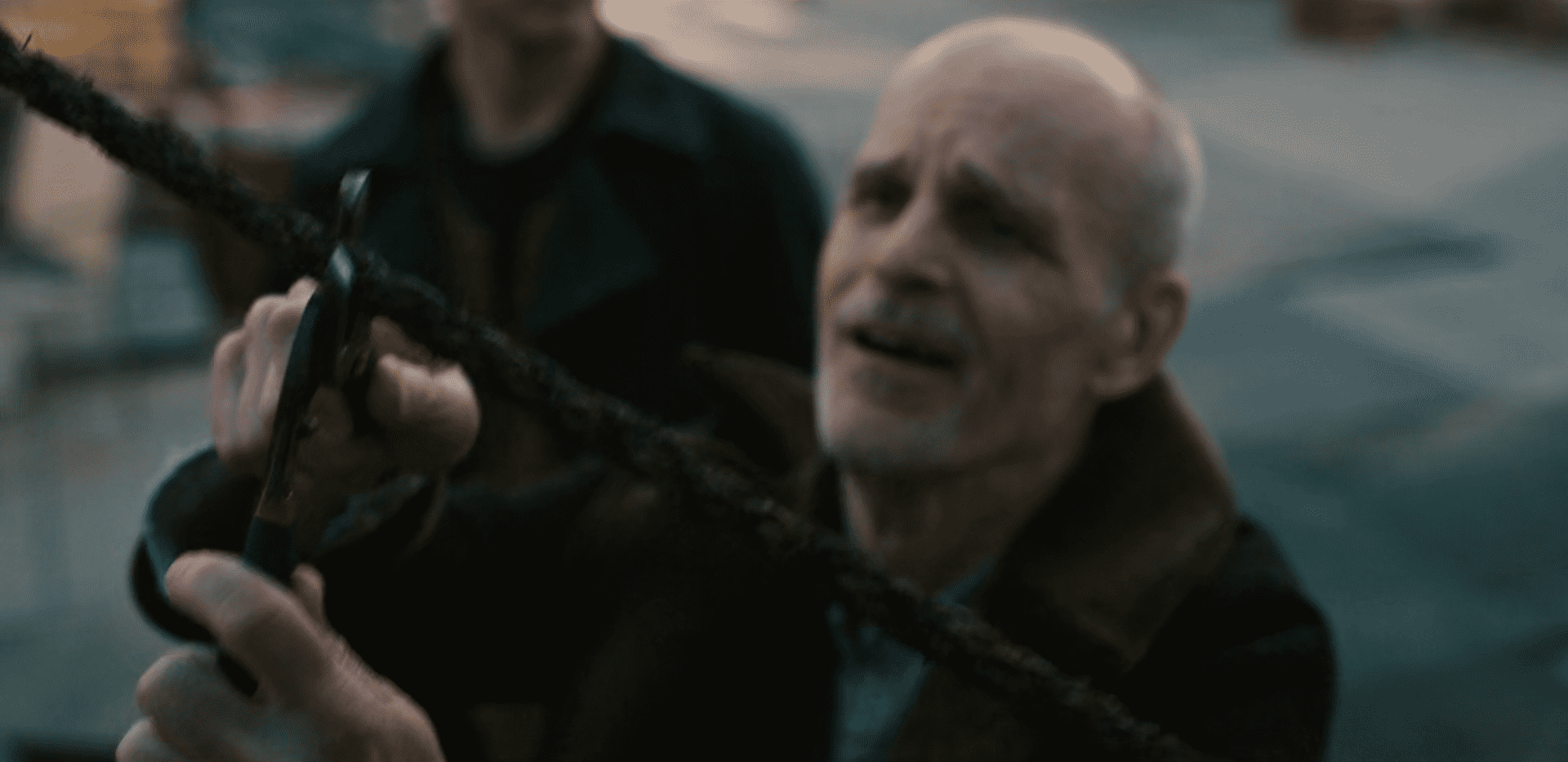 The Croat cuts the rope as he watches a man plummet to his death in 'The Walking Dead: Dead City' Episode 1 (AMC+)