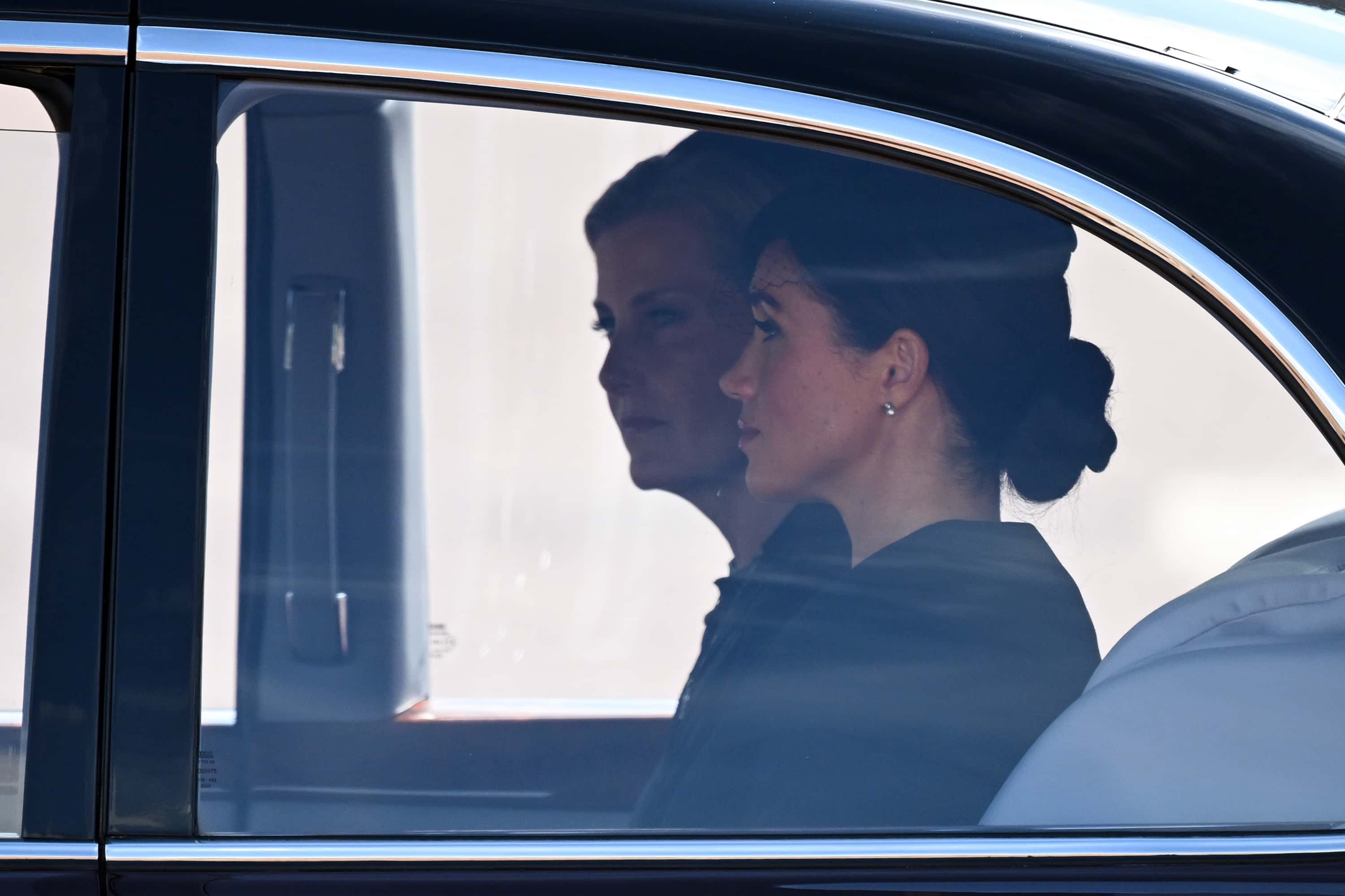 Sophie, Countess of Wessex and Meghan, Duchess of Sussex are driven in a car during the procession for the Lying-in State of Queen Elizabeth II on September 14, 2022 in London, England. Queen Elizabeth II's coffin is taken in procession on a Gun Carriage of The King's Troop Royal Horse Artillery from Buckingham Palace to Westminster Hall where she will lay in state until the early morning of her funeral. Queen Elizabeth II died at Balmoral Castle in Scotland on September 8, 2022, and is succeeded by her eldest son, King Charles III.