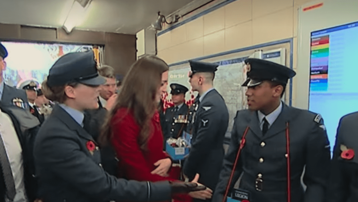 A still from 'Harry & Meghan' showing Kate Middleton meeting people (Netflix)