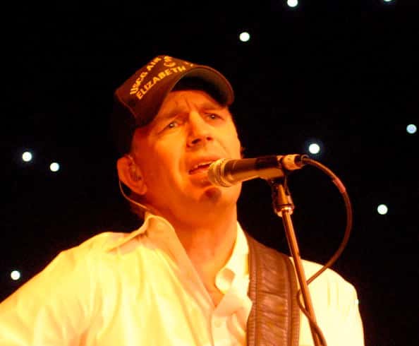 Kevin Costner & Modern West perform on stage in 2009 (Photo by Tim Boyles/Getty Images)