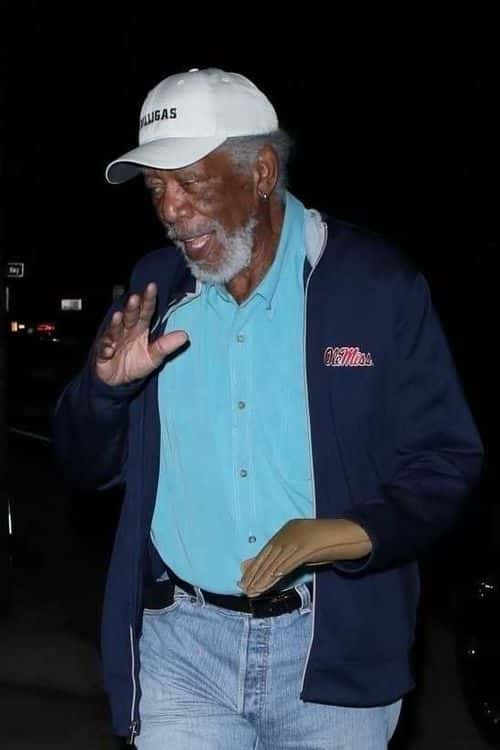 Morgan Freeman waves at the paps