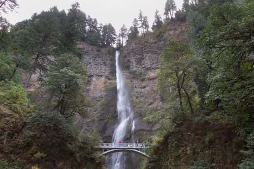 Visitors on a bridge admire the  Multnomah Waterfalls, in the Columbia River Gorge National Scenic Area September 26, 2014 in Multnomah Falls, Oregon. Following considerable public outcry, the U.S. Forest Service announced Thursday it will delay finalizing restrictive rules requiring media to purchase special permits to shoot photos or videos in wilderness areas.