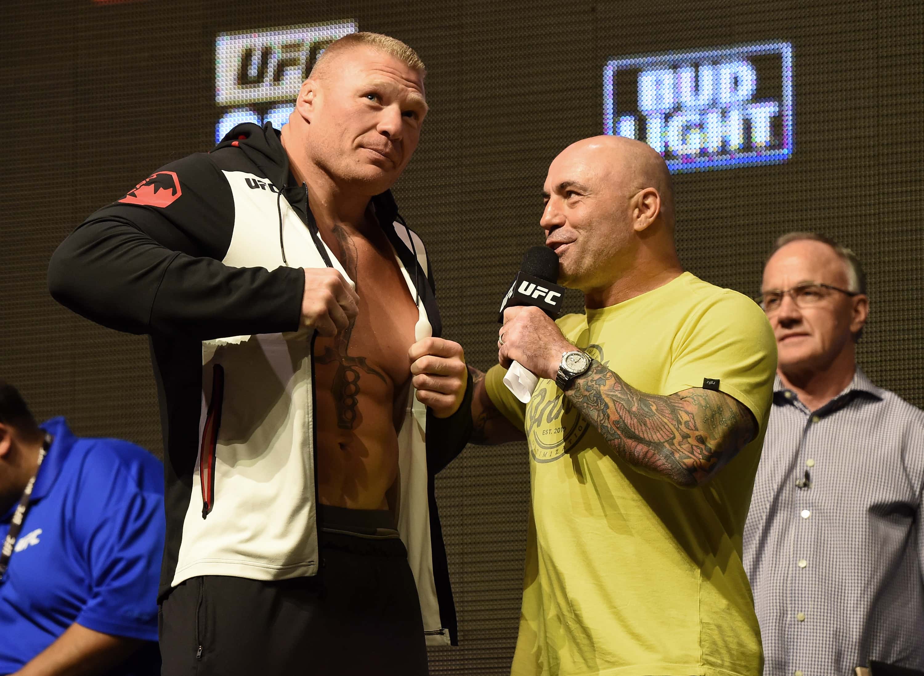 Mixed martial artist Brock Lesnar (L) is interviewed by commentator Joe Rogan after Lesnar's weigh-in for UFC 200 at T-Mobile Arena on July 8, 2016 in Las Vegas, Nevada. Lesnar will meet Mark Hunt in a heavyweight bout on July 9 at T-Mobile Arena.