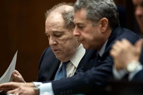 Former film producer Harvey Weinstein (L) interacts with his attorney Mark Werksman in court at the Clara Shortridge Foltz Criminal Justice Center on October 4, 2022 in Los Angeles, California. Harvey Weinstein was extradited from New York to Los Angeles to face sex-related charges.