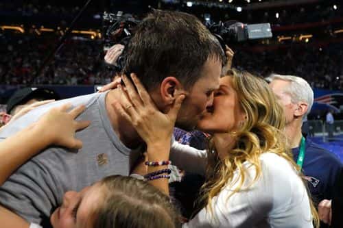 Tom Brady #12 of the New England Patriots kisses his wife Gisele Bündchen after the Super Bowl LIII against the Los Angeles Rams at Mercedes-Benz Stadium on February 3, 2019 in Atlanta, Georgia. The New England Patriots defeat the Los Angeles Rams 13-3.