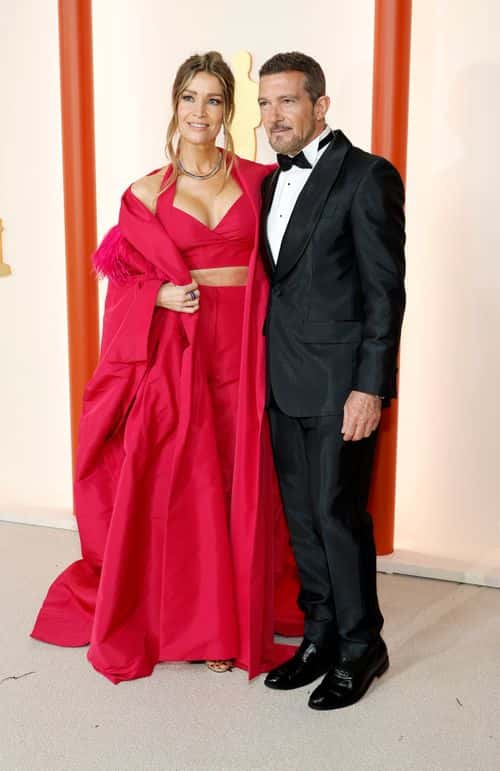 (L-R) Nicole Kimpel and Antonio Banderas attend the 95th Annual Academy Awards on March 12, 2023 in Hollywood, California.