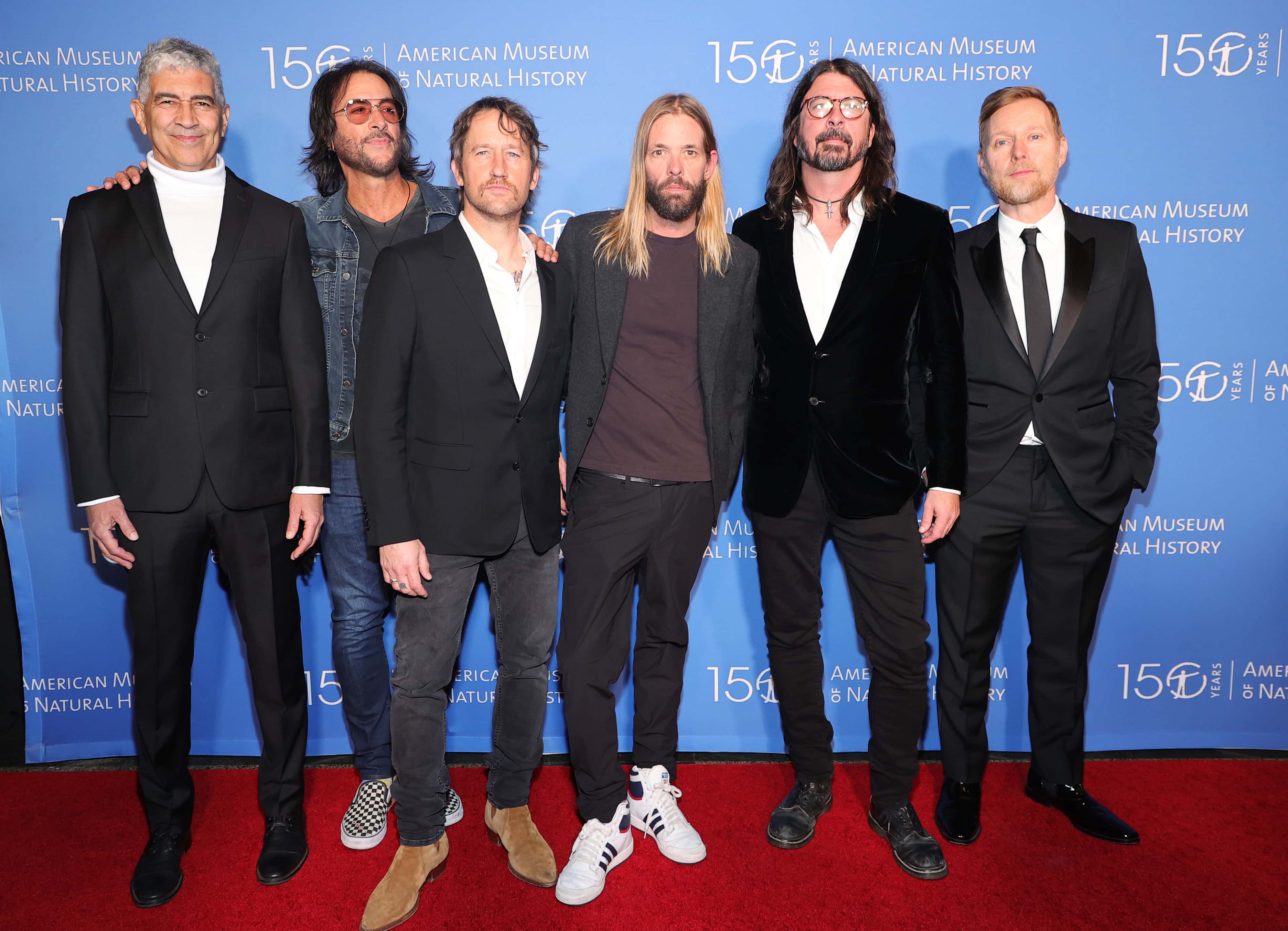 (L-R) Pat Smear, Rami Jaffee, Chris Shiflett, Taylor Hawkins, Dave Grohl and Nate Mendel, members of the Foo Fighters, attend the American Museum of Natural History Gala 2021 on November 18, 2021 in New York City.