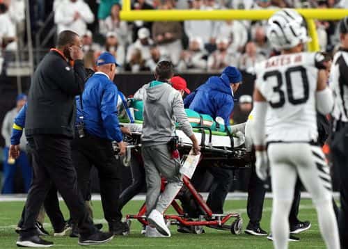 Medical staff tend to quarterback Tua Tagovailoa #1 of the Miami Dolphins as he is carted off on a stretcher after an injury during the 2nd quarter of the game against the Cincinnati Bengals at Paycor Stadium on September 29, 2022 in Cincinnati, Ohio.