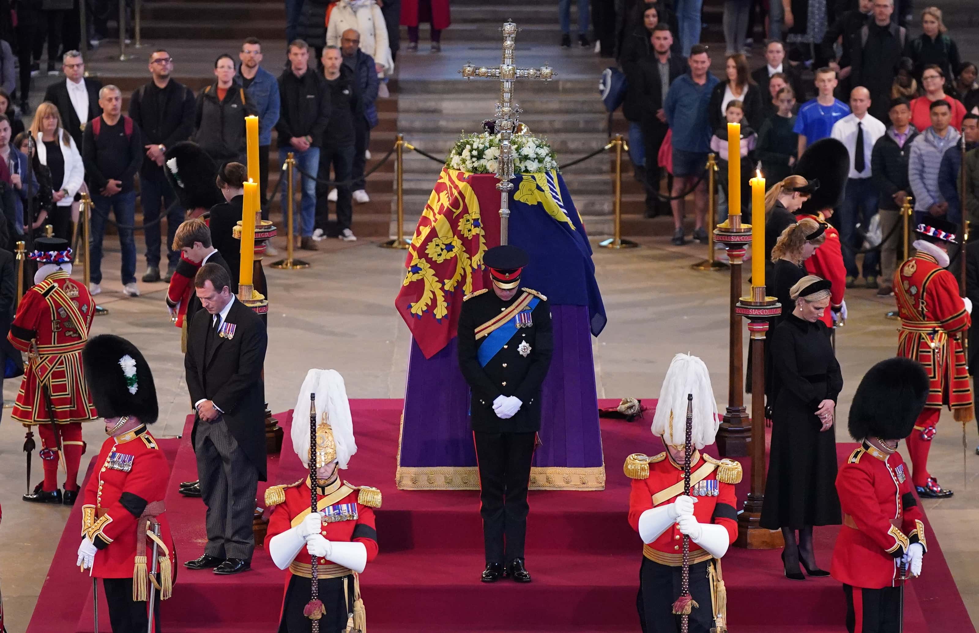 Queen Elizabeth II 's grandchildren (clockwise from front centre) Prince William, Prince of Wales, Peter Phillips, James, Viscount Severn, Princess Eugenie, Prince Harry, Duke of Sussex, Princess Beatrice, Lady Louise Windsor and Zara Tindall hold a vigil beside the coffin of their grandmother as it lies in state on the catafalque inside Westminster Hall on September 17, 2022 in London, England. Queen Elizabeth II's grandchildren mount a family vigil over her coffin lying in state in Westminster Hall. Queen Elizabeth II died at Balmoral Castle in Scotland on September 8, 2022, and is succeeded by her eldest son, King Charles III.