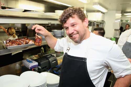 Chef Ben Ford prepares food at the Retro Feast Dinner hosted by Ben Ford, Ashley Christensen and Jonathan Lane as a part of The New York Times Dinner Series during the 2015 Food Network & Cooking Channel South Beach Wine & Food Festival presented by FOOD & WINE at Metropolitan by COMO on February 19, 2015 in Miami Beach, Florida.
