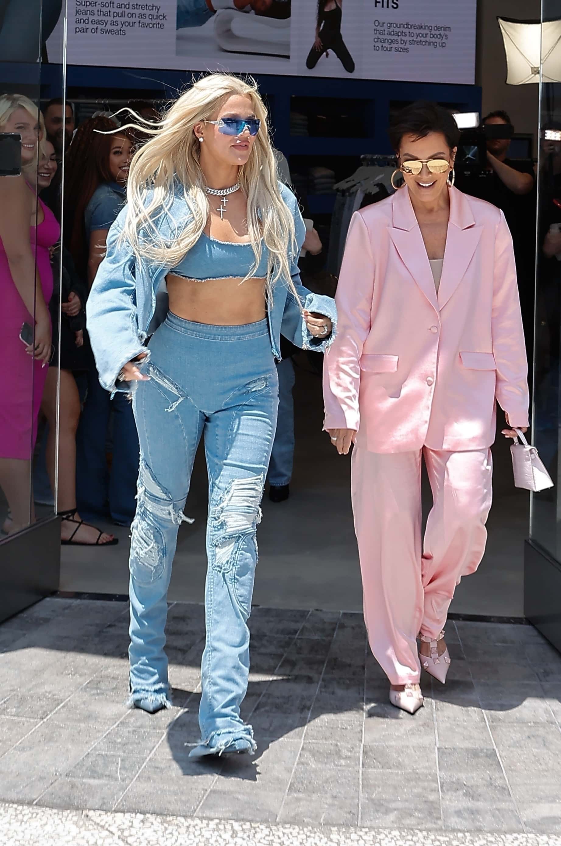 Khloe, Kim's matchmaking target for Michele Morrone, rocked a full Good American ensemble: distressed light-wash jeans, a cute bandeau top, and a matching cropped denim jacket (Backgrid)
