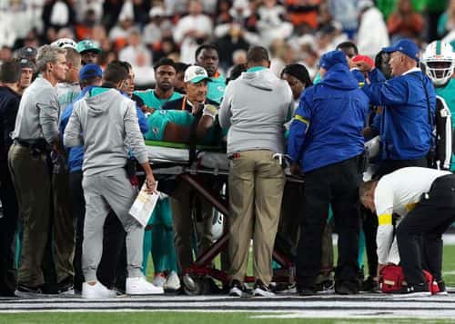 Medical staff tend to quarterback Tua Tagovailoa #1 of the Miami Dolphins as he is carted off on a stretcherafter an injury during the 2nd quarter of the game against the Cincinnati Bengals at Paycor Stadium on September 29, 2022 in Cincinnati, Ohio.