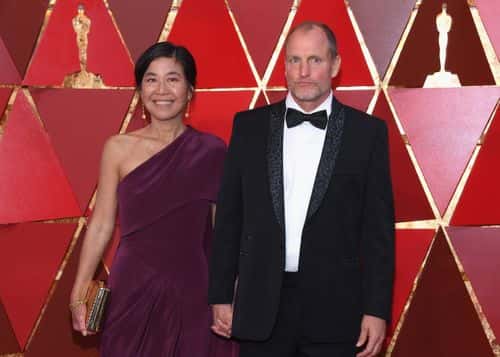 Woody Harrelson (R) and Laura Louie attend the 90th Annual Academy Awards at Hollywood & Highland Center on March 4, 2018 in Hollywood, California.