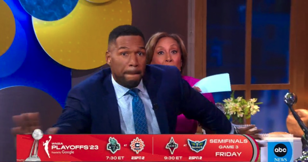 After Michael Strahan was done playing, he got up and Robin Roberts swatted his butt with cue cards (ABC)
