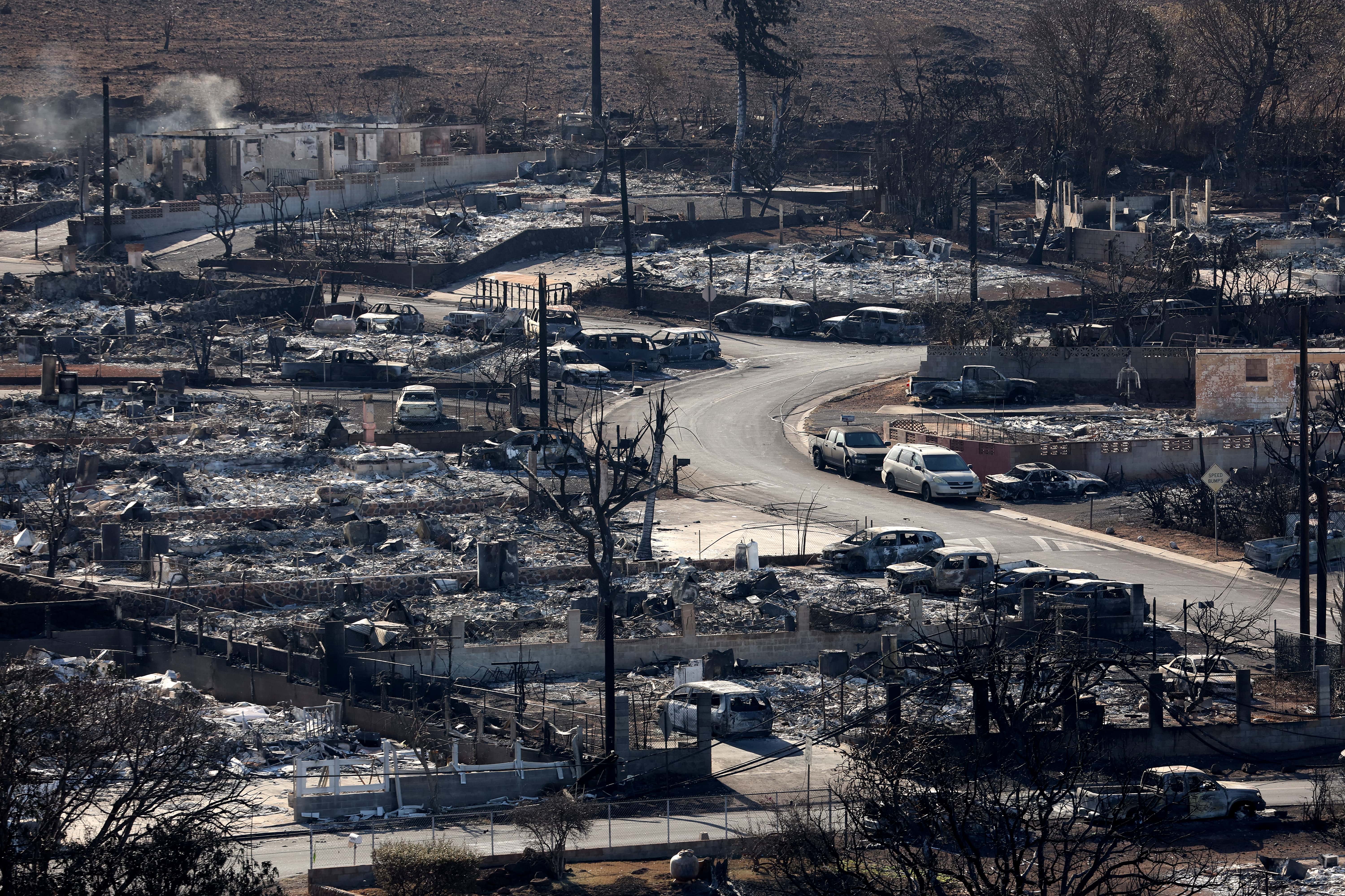 In an aerial view, homes and businesses are seen that were destroyed by a wildfire on August 11, 2023 in Lahaina, Hawaii. Dozens of people were killed and thousands were displaced after a wind-driven wildfire devastated the town of Lahaina on Tuesday. Crews are continuing to search for missing people.