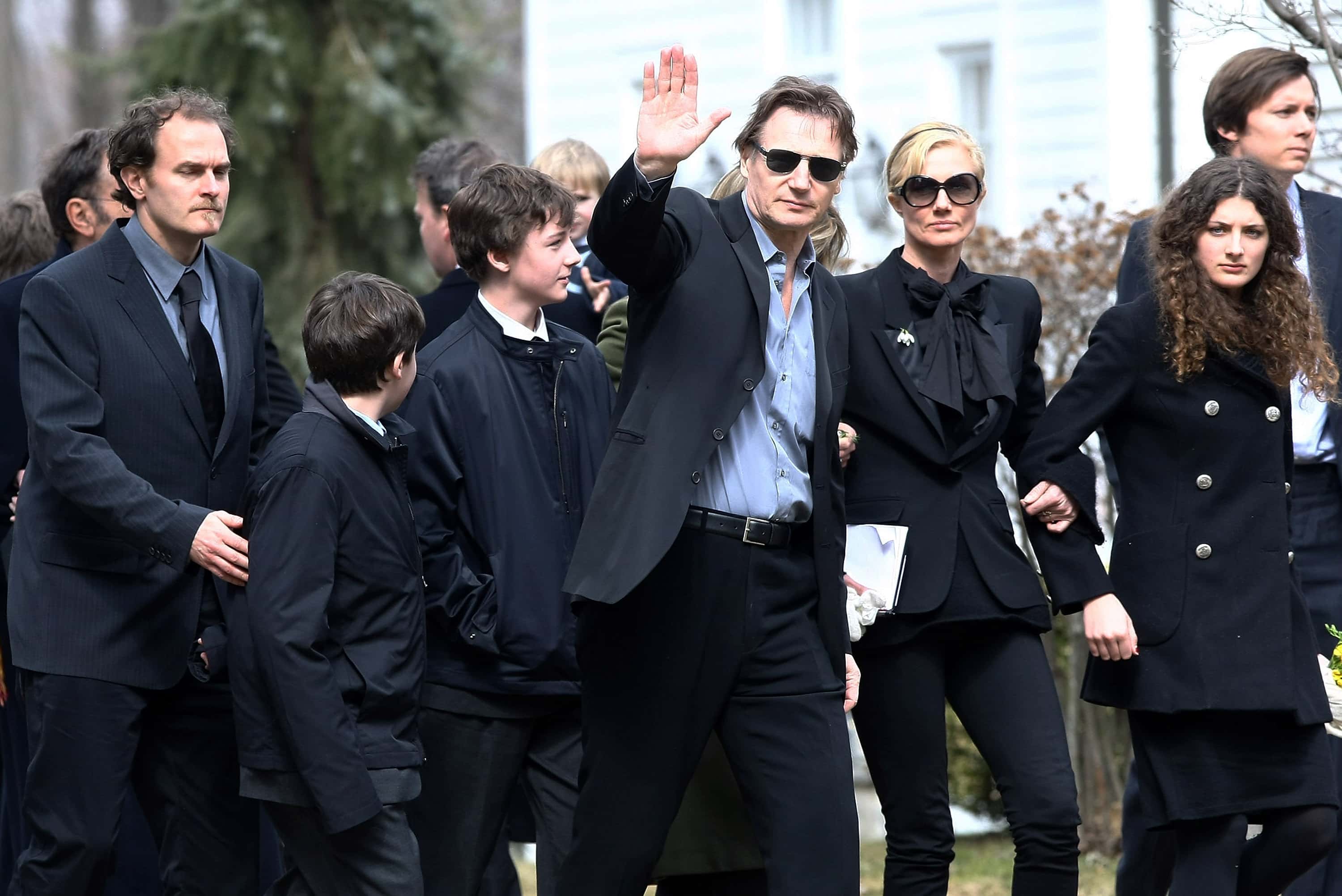 Actor Liam Neeson (waving) with (L-R) screenwriter Carlo Gabriel Nero, son Daniel Neeson, son Micheal Neeson, sister Joely Richardson, and niece Daisy Bevan arrive for the funeral of actress Natasha Richardson at St. Peter's Lithgow Episcopal Church on March 22, 2009 in Lithgow, New York. Richardson died at Lenox Hill Hospital on March 18 in New York City after suffering a ski injury at the Mont Tremblant resort in Montreal.