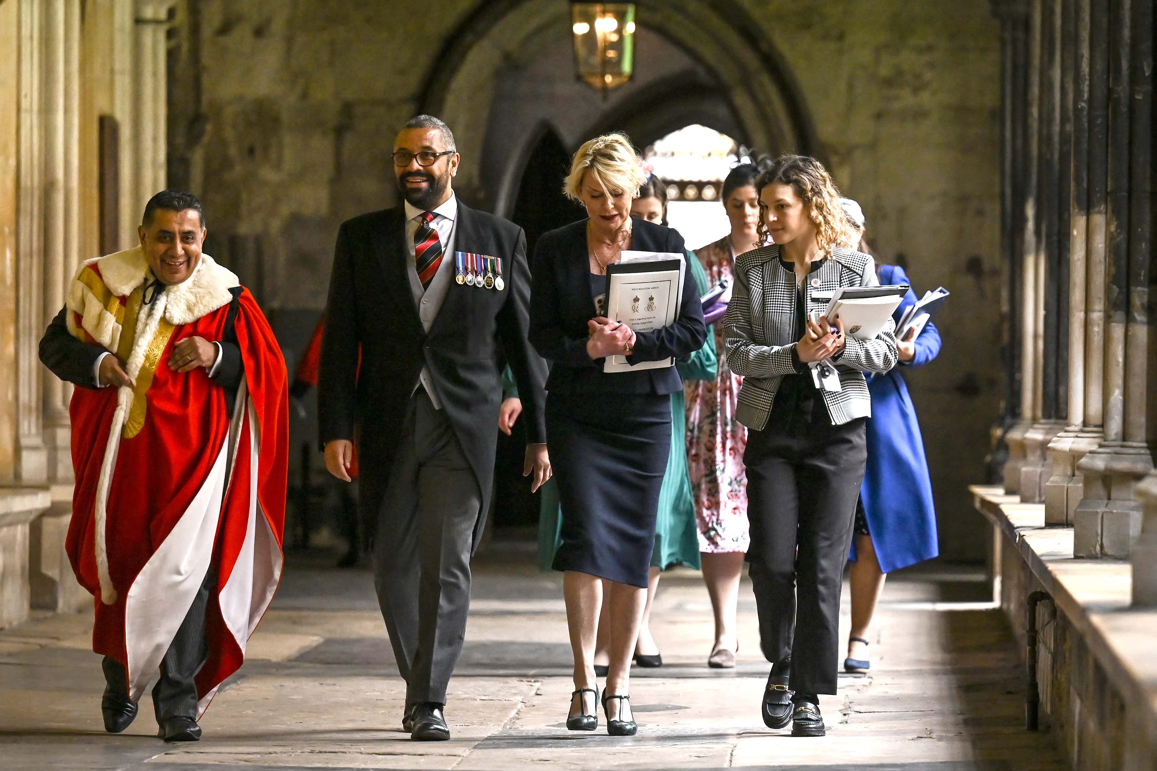 Britain's Foreign Secretary James Cleverly (2L) arrives to take his seat inside at Westminster Abbey ahead of the Coronation of King Charles III and Queen Camilla on May 6, 2023 in London, England. The Coronation of Charles III and his wife, Camilla, as King and Queen of the United Kingdom of Great Britain and Northern Ireland, and the other Commonwealth realms takes place at Westminster Abbey today. Charles acceded to the throne on 8 September 2022, upon the death of his mother, Elizabeth II. (Photo by Ben Stansall - WPA Pool/Getty Images)