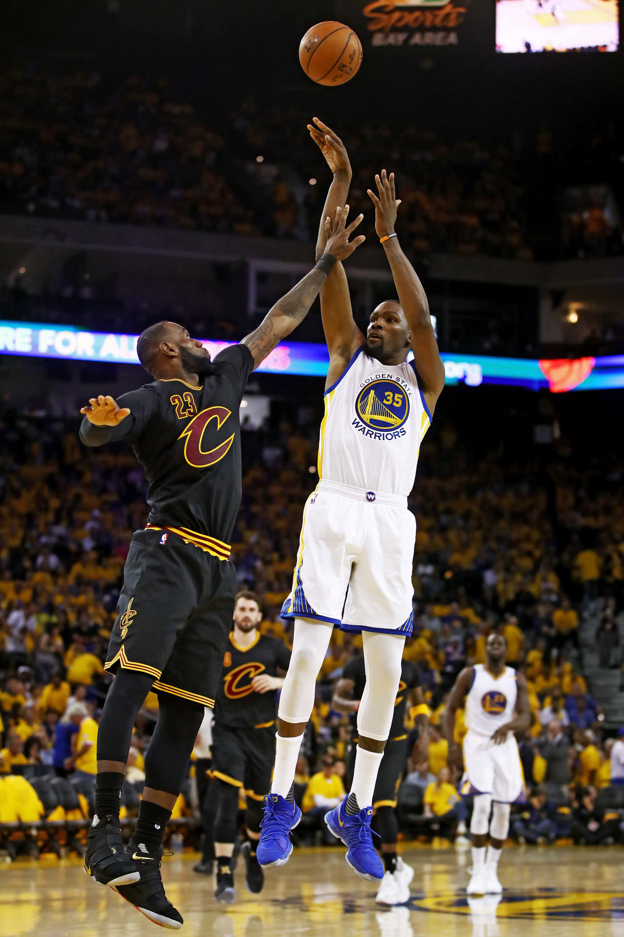 OAKLAND, CA - JUNE 04: Kevin Durant #35 of the Golden State Warriors attempts a shot defended by LeBron James #23 of the Cleveland Cavaliers during the second half of Game 2 of the 2017 NBA Finals at ORACLE Arena on June 4, 2017 in Oakland, California. NOTE TO USER: User expressly acknowledges and agrees that, by downloading and or using this photograph, User is consenting to the terms and conditions of the Getty Images License Agreement. (Photo by Ezra Shaw/Getty Images)
