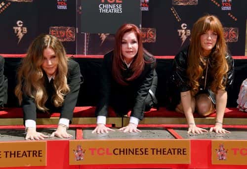 (L-R) Lisa Marie Presley, Priscilla Presley, and Riley Keough attend the Handprint Ceremony honoring Priscilla Presley, Lisa Marie Presley And Riley Keough at TCL Chinese Theatre on June 21, 2022 in Hollywood, California. (Photo by Jon Kopaloff/Getty Images)