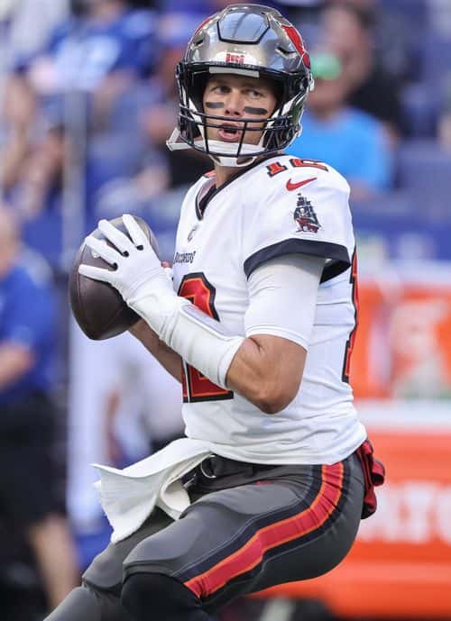 Tom Brady #12 of Tampa Bay Buccaneers warms up before the game against the Indianapolis Colts at Lucas Oil Stadium on August 27, 2022 in Indianapolis, Indiana.