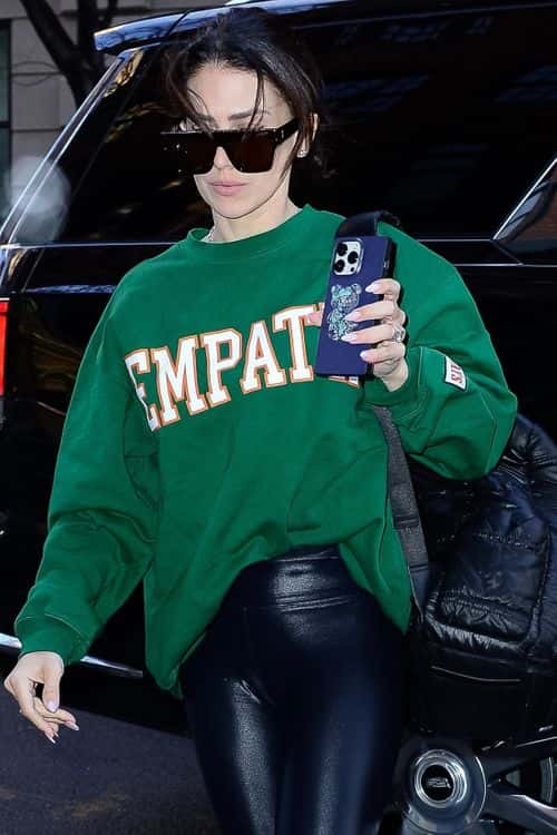 Hilaria Baldwin sports green crewneck sweatshirt with the word 'Empathy' on it one day after husband Alec Baldwin's arrest for manslaughter.  (Backgrid)