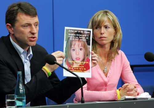 Kate and Gerry McCann, the parents of the missing 4-year-old British girl Madeleine McCann, display a poster of their missing daughter during a press conference on June 6, 2007 in Berlin, Germany. Kate and her husband Gerry are in Berlin to spread the word in the search for their missing duaghter Madeleine who disappeared from their holiday apartment in Praia da Luz, Portugal on May 3, 2007. (Photo by Miguel Villagran/Getty Images)