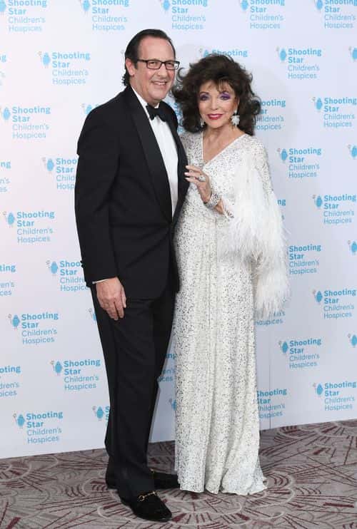Percy Gibson and Dame Joan Collins attends the Shooting Star Ball in aid of Shooting Star Children's Hospices at the Royal Lancaster Hotel on November 12, 2021 in London, England.