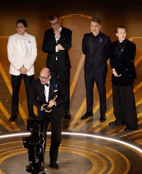 (L-R) Daniel Brühl, Edward Berger, Malte Grunert, Albrecht Schuch and Felix Kammerer accept the Best International Feature Film award for