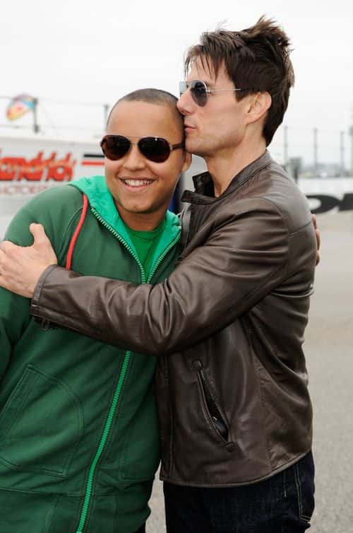Actor Tom Cruise hugs his son Connor Antony on track prior to the NASCAR Sprint Cup Series Daytona 500 at Daytona International Speedway on February 15, 2009 in Daytona Beach, Florida.