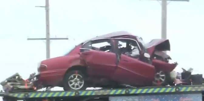The cops clearing Edith Schmucker's car from the accident spot (screenshot via NBC)