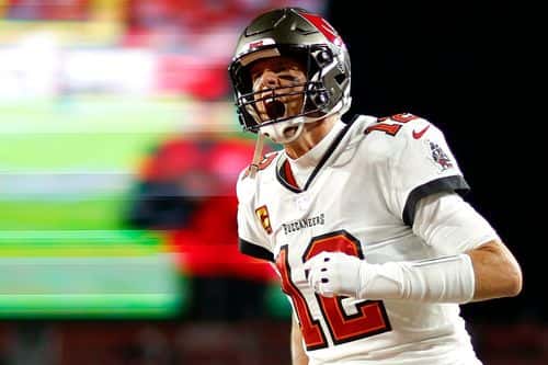Tom Brady #12 of the Tampa Bay Buccaneers yells as he runs on the field prior to the NFC Wild Card playoff game against the Dallas Cowboys at Raymond James Stadium on January 16, 2023 in Tampa, Florida.