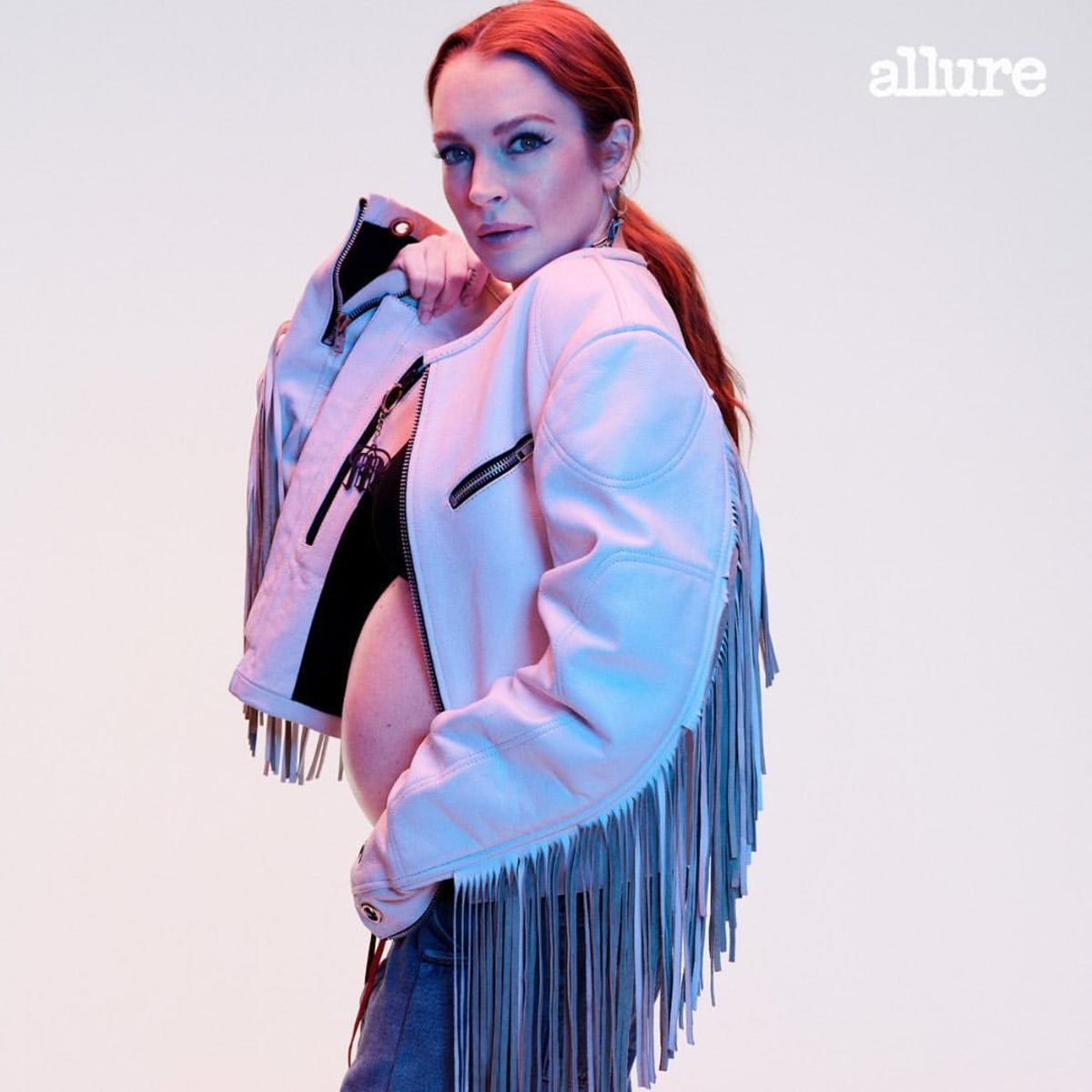 Lohan showed off her bump in June, 2023, posing for the cover of Allure magazine (@lindsaylohan/Instagram)
