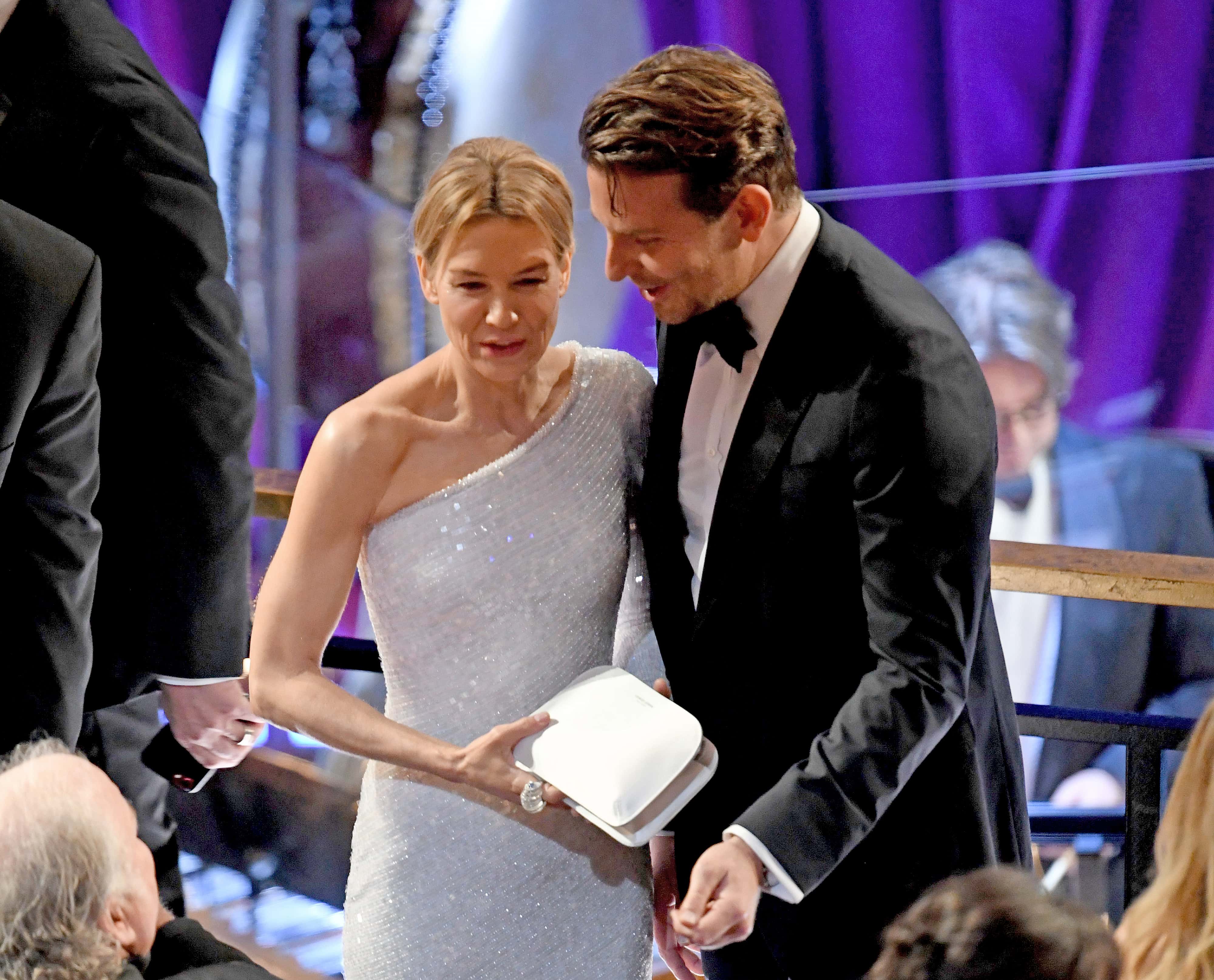 (L-R) Renée Zellweger and Bradley Cooper attend the 92nd Annual Academy Awards at Hollywood and Highland on February 09, 2020 in Hollywood, California.