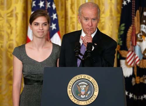 U.S.  Vice President Joe Biden (R) introduces Lilly Jay (L), a survivor of sexual assault,  at the launch of the 